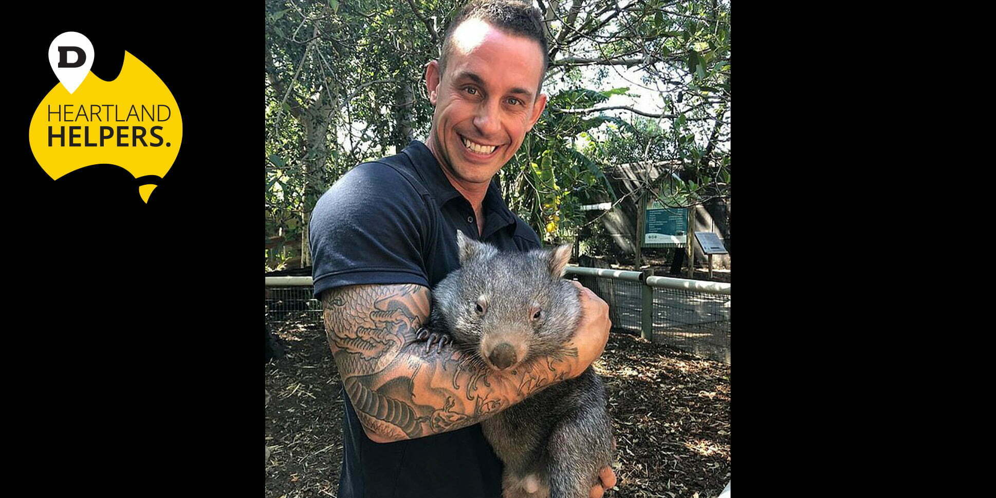 mogo zoo staff holding a koala